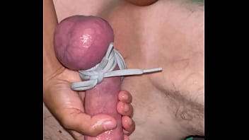 Tying his balls tight while i fist his ass