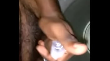 Boy in bathroom with bucket