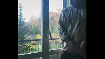 I jerk off in front of the window hoping someone sees me