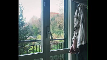 I jerk off in front of the window hoping someone sees me