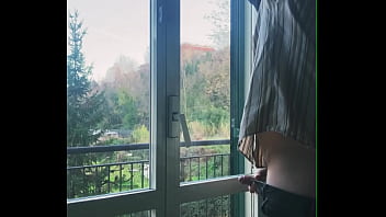 I jerk off in front of the window hoping someone sees me