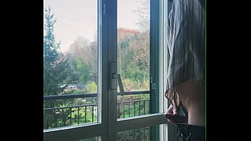 I jerk off in front of the window hoping someone sees me