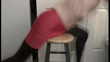Grinding on stool in black compression tights and red compression shorts