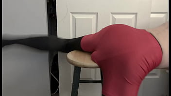Grinding on stool in black compression tights and red compression shorts