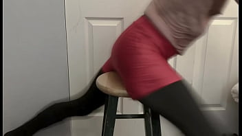 Grinding on stool in black compression tights and red compression shorts