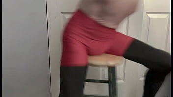 Grinding on stool in black compression tights and red compression shorts