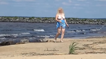 Hot mom on the beach in white swimsuit