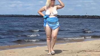 Hot mom on the beach in white swimsuit