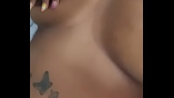 Playing wit her titties