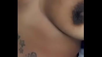 Playing wit her titties