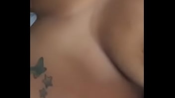 Playing wit her titties