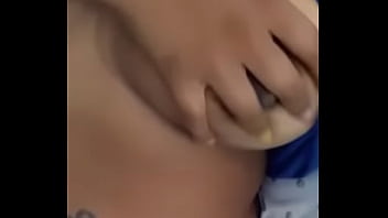 Playing wit her titties