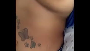 Playing wit her titties