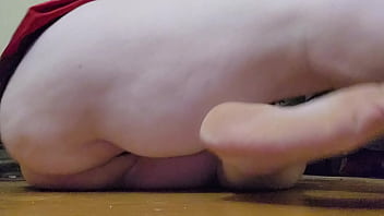 Bent over with toy from behind