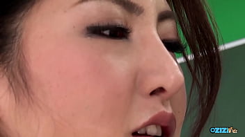 This attractive woman engaged in oral sex with two men resulting in ejaculation over her face