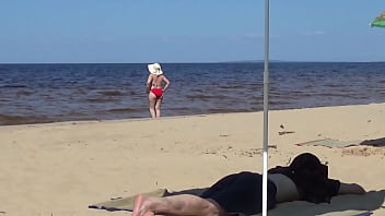 Nimble mature mommy has fun with young guys on the beach