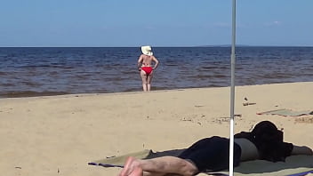 Nimble mature mommy has fun with young guys on the beach