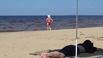 Nimble mature mommy has fun with young guys on the beach