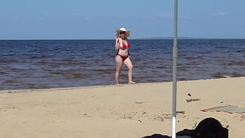 Nimble mature mommy has fun with young guys on the beach