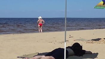Nimble mature mommy has fun with young guys on the beach