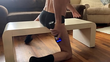 Preview of agressive myofascial pressure and release stretching on table in underwear with percussion massager