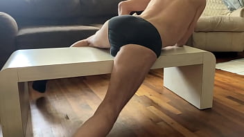 Preview of agressive myofascial pressure and release stretching on table in underwear with percussion massager