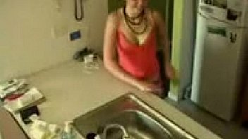 Brunette teen has an intense orgasm masturbating in the kitchen sink