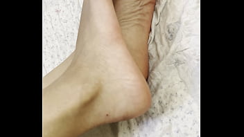 Arab hijab girl in niqab teases her cute feet and soft soles