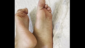 Arab hijab girl in niqab teases her cute feet and soft soles