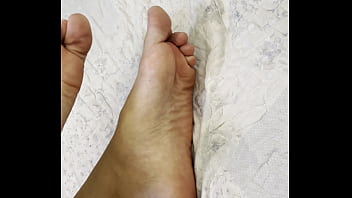 Arab hijab girl in niqab teases her cute feet and soft soles