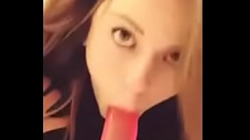 Beautiful eyes girl sucking dildo