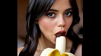 Wednesday addams playing with the banana