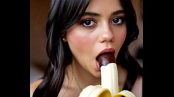 Wednesday addams playing with the banana