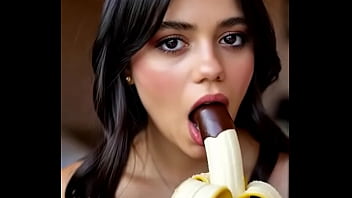 Wednesday addams playing with the banana