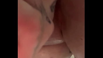 Slut rubs juicy clit down