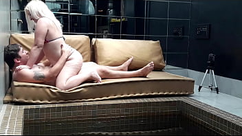 Hot girl playing in the pool with her friend while her husband works