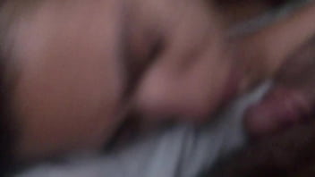 Sucking off his friend while lying down while his husband films