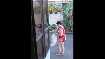 Public kiwi slutty bitch carries out the rubbish wearing red fishnet mini dress in full view