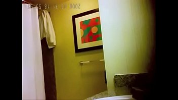 Cute brunette getting ready for a shower