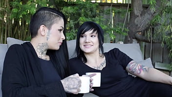 Beautiful lesbo tattoed girl sucking and licking