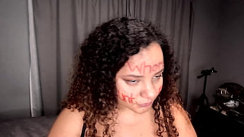 Bbw colored girl deepthroating a dildo after writing dirty words on her whore face