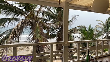 Ebony wife flashes pussy at a beach house