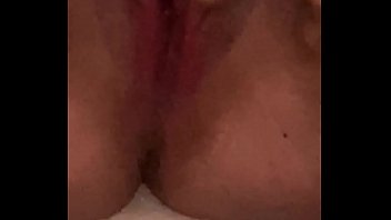 Young girl moans while fucking herself