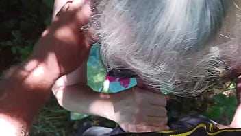 Hot milf giving friend a blowjob in the woods