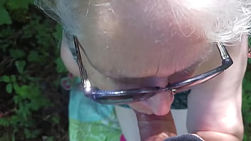 Hot milf giving friend a blowjob in the woods