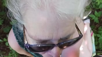 Hot milf giving friend a blowjob in the woods Hot milf giving friend a blowjob in the woods