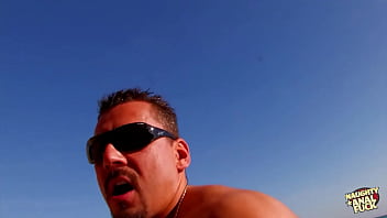 She undressed at the beach and the fortunate man approached to engage in anal intercourse with her