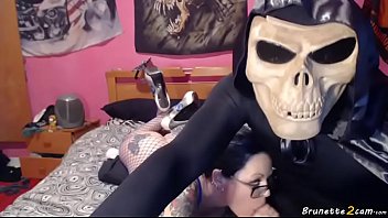 Blue eyed busty brunette playing with the d