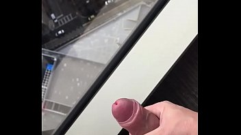Me Wanking With Big Cumshot Over Hotel Room Window During Daylight thumbnail