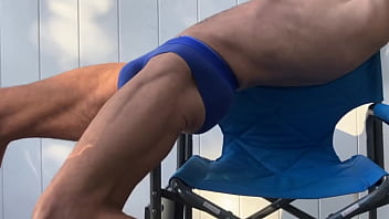 Deep pelvic stretching in blue briefs on blue chair late october 2024